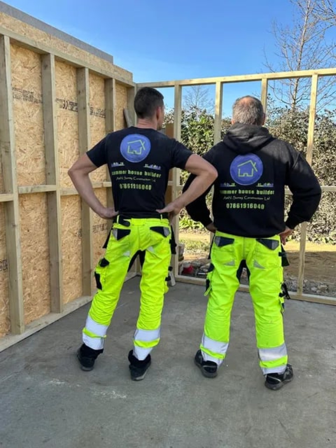 A&N Surrey Construction team at work beside a garden room timber frame