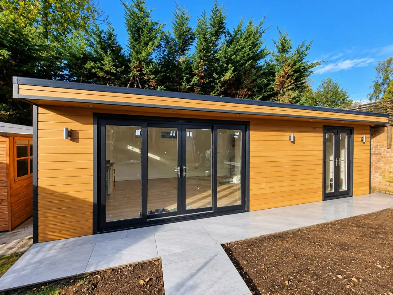 Wide Garden Room with Dark Doors